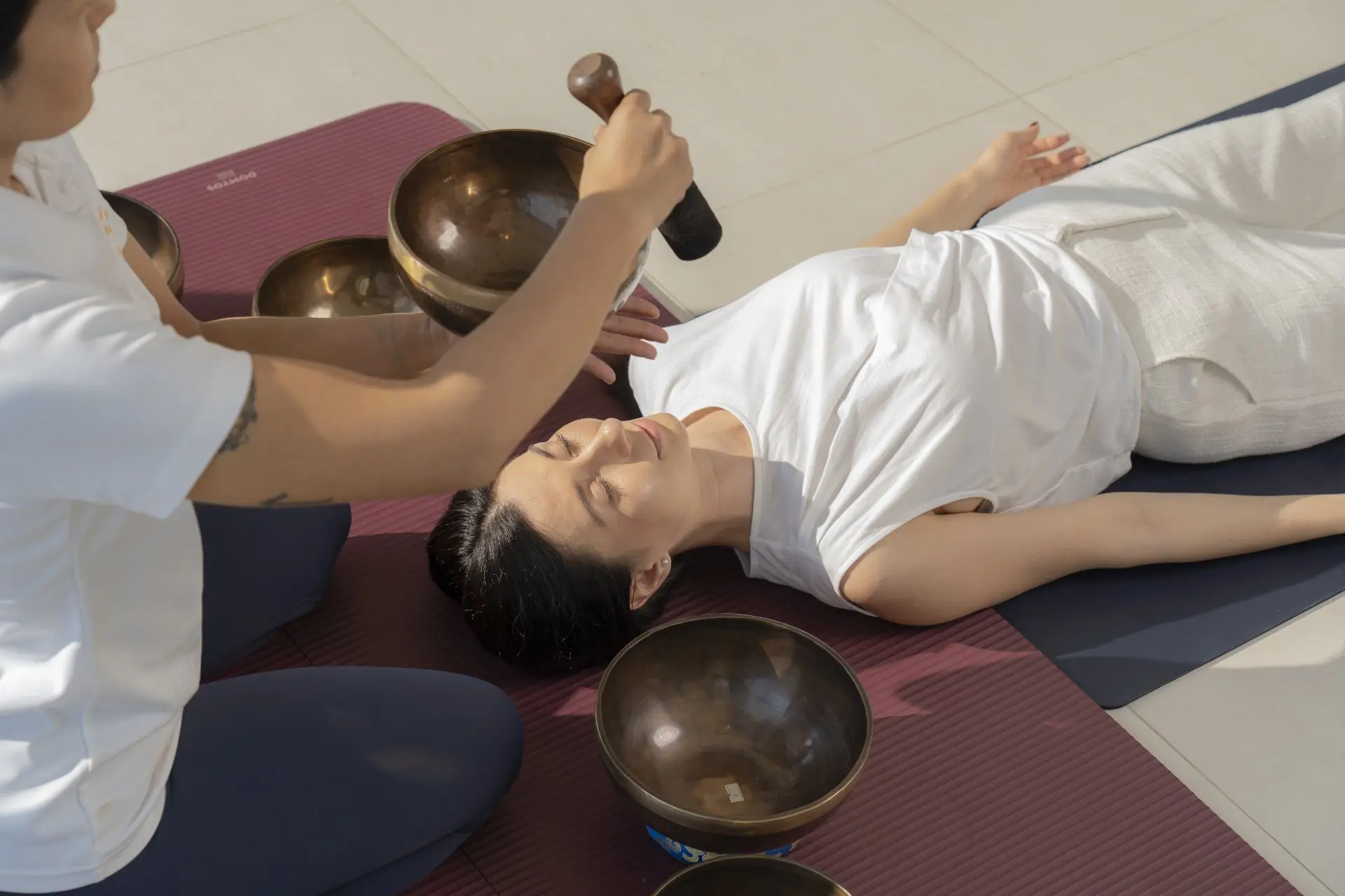Sound healing session with singing bowls at Viva Rehab Thailand, seen from above