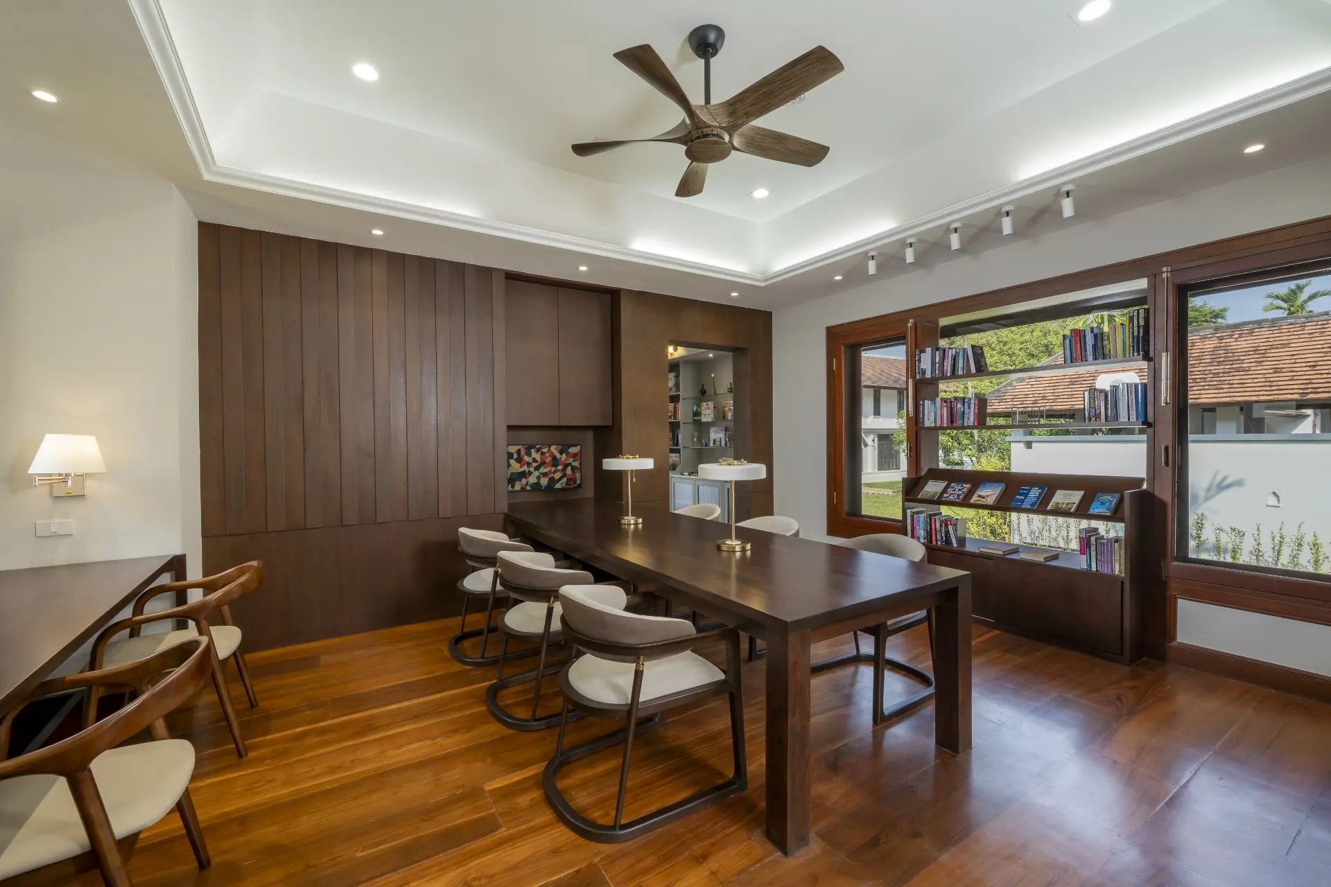 Library and meeting room with a long wooden table at Viva Rehab Thailand