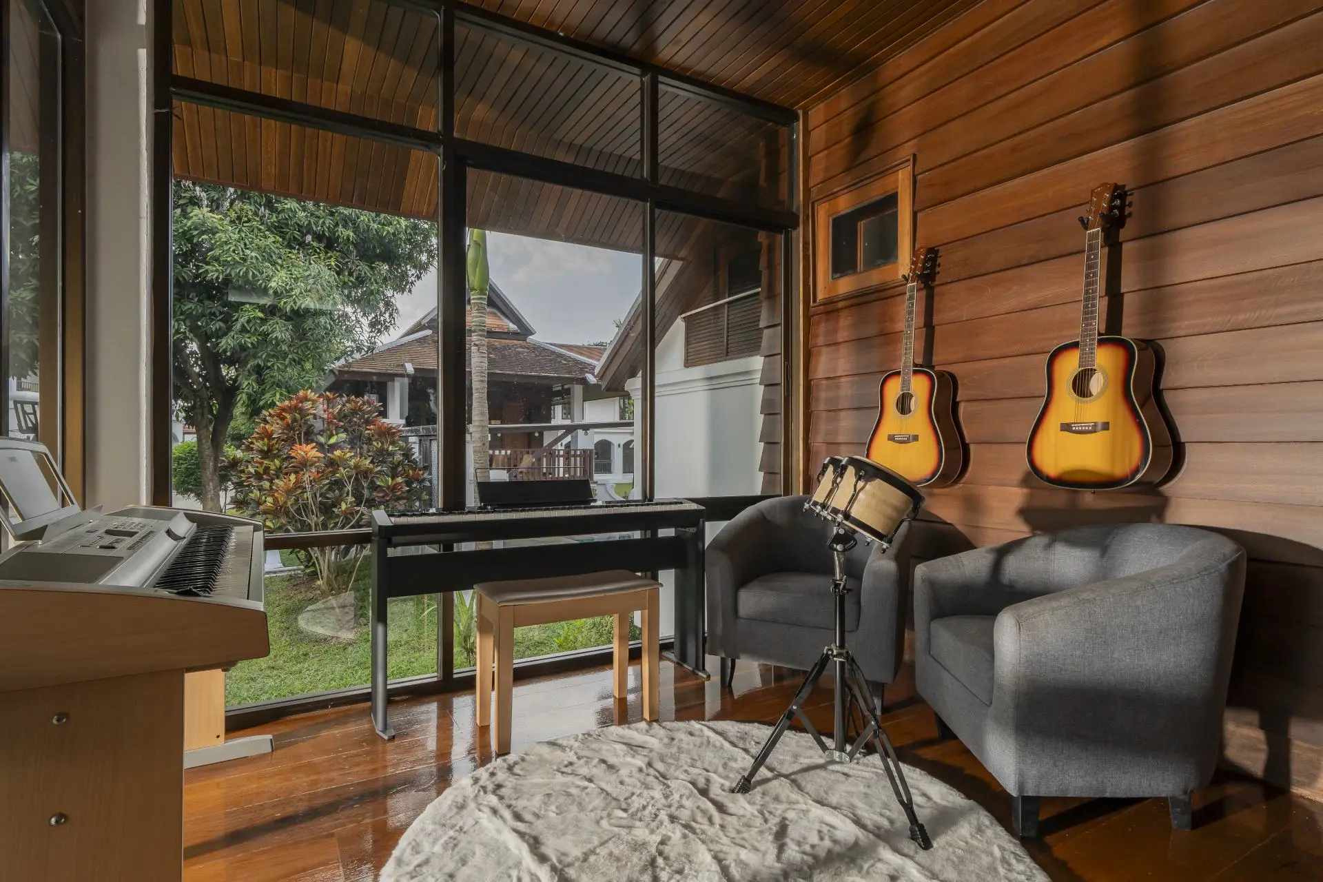 Music therapy room with guitars, piano and drums at Viva Rehab Thailand
